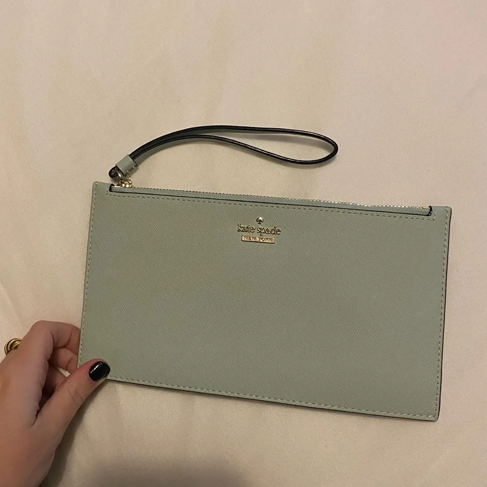 kate spade mint green wristlet clutch with gold logo